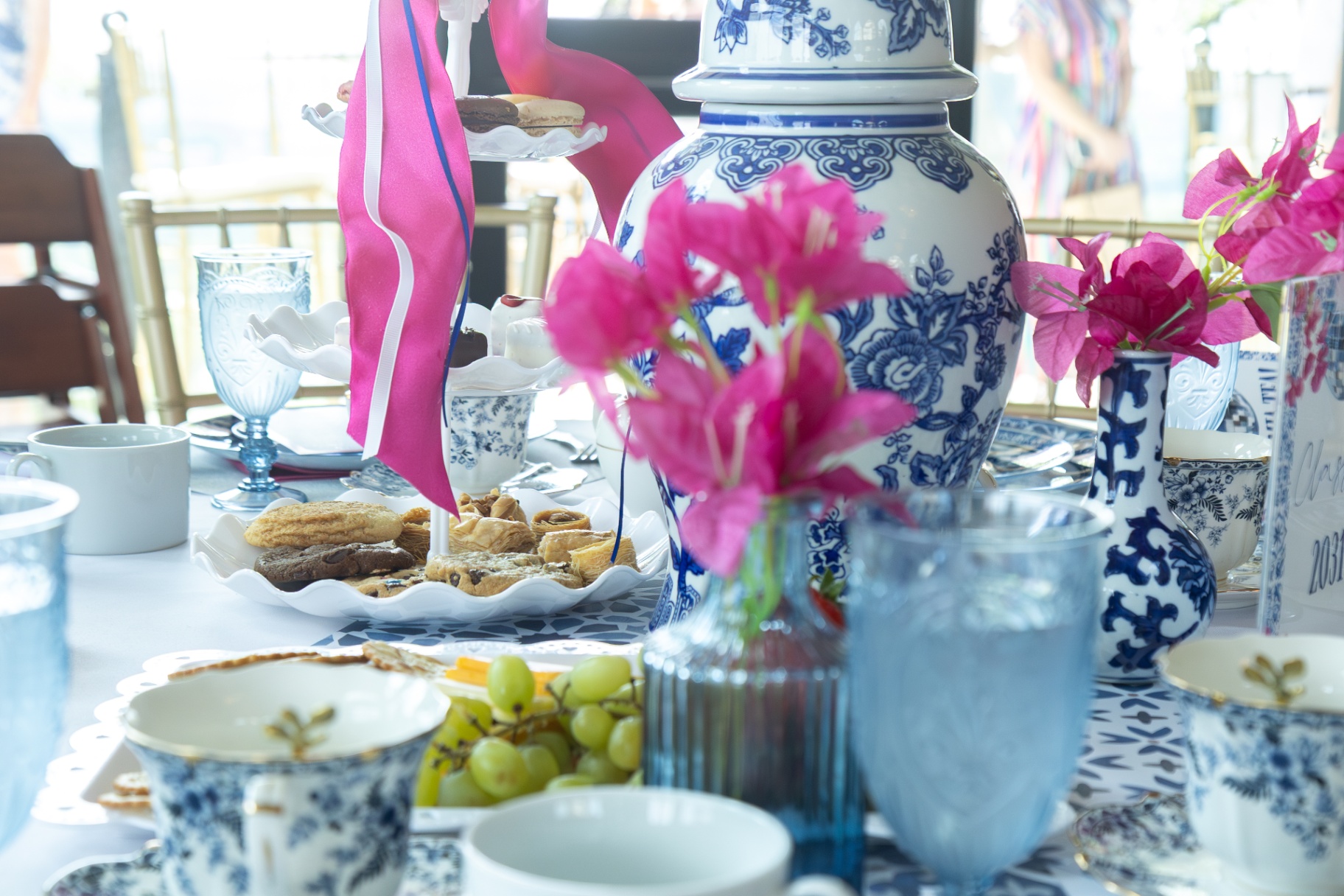 Blue and white tea set and dessert tower on a celebration table.