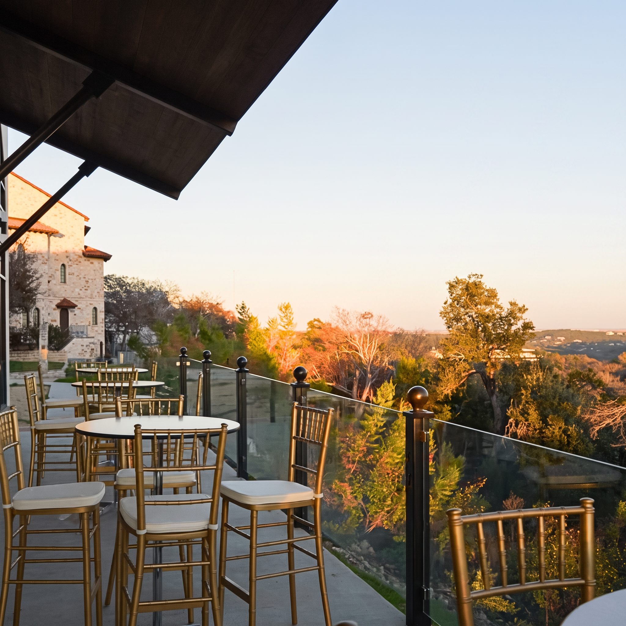 Cocktail tables on the terrace at sunset.