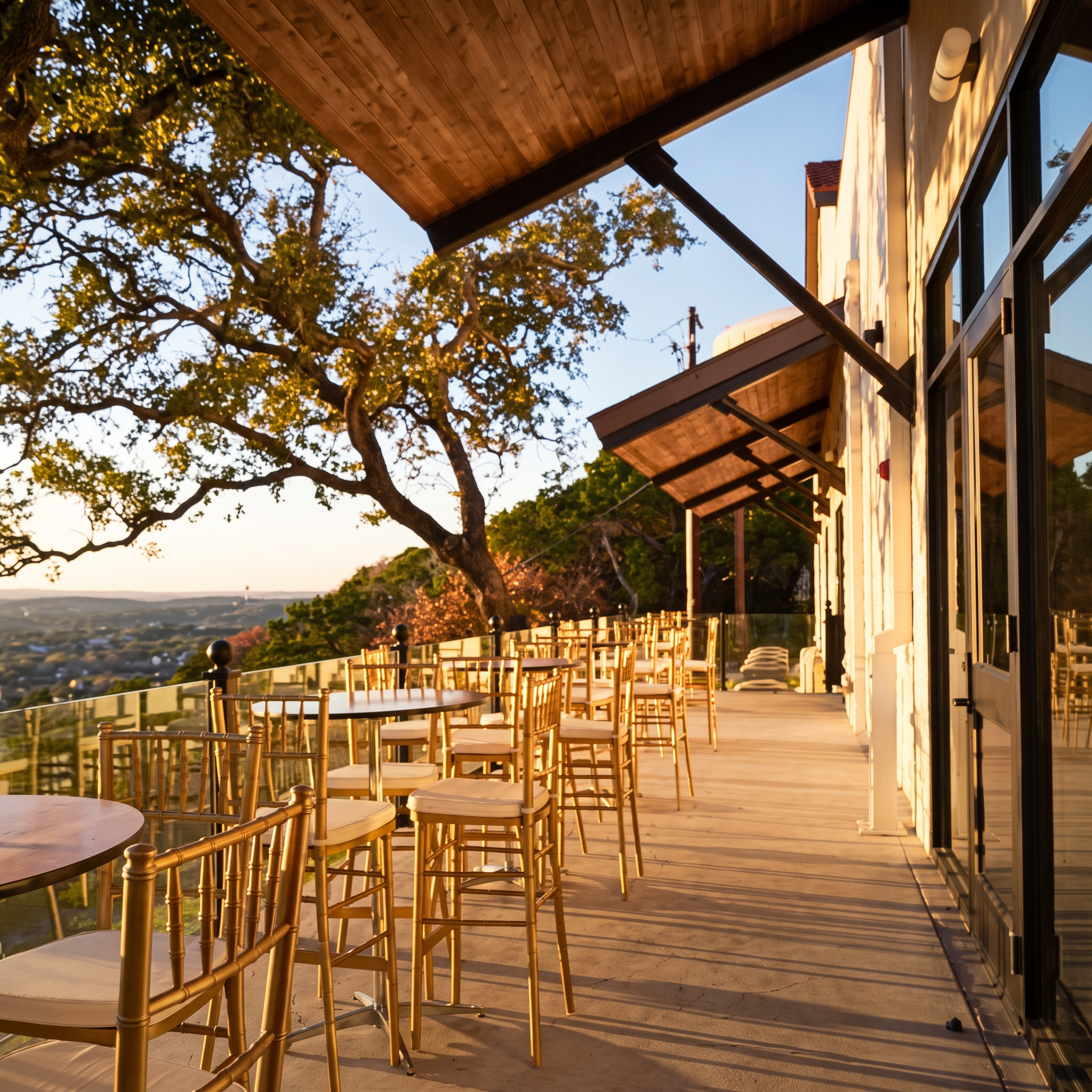 The sunset terrace beneath a live oak.